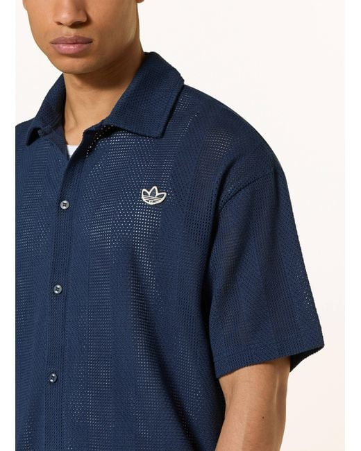 Adidas Originals
Camisa de manga corta para hombre SUMMER KNIT SHOOTING Comfort Fit en azul